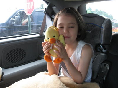 Sarah riding to the air show with her duckie
