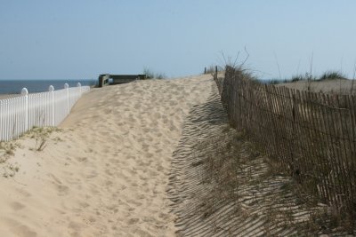 The sand is taking over the pathway to the beach