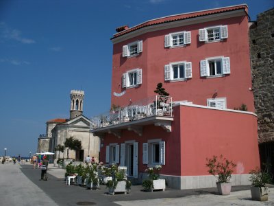 Pastel house and St. Clement's church
