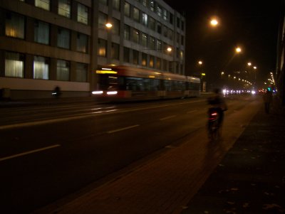 Tram and a bike on a industrial stretch