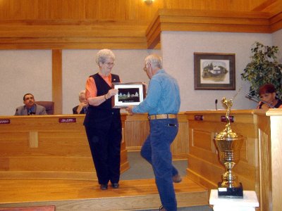  Pops presenting a photo of City Hall to Mayor Myers