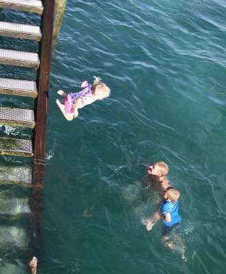Charli, nearly 4, jumping off the wharf