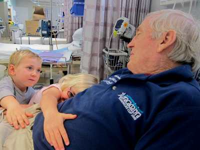 Charli and Toby loving Pop at hospital