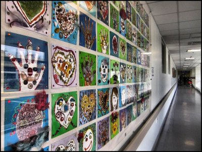 Wall of colourful hands, hearts and faces