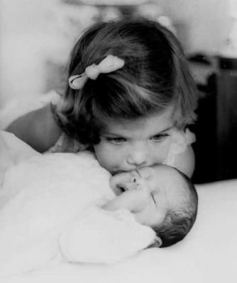 Caroline Kennedy, 3, kissing her baby brother John F. Kennedy Jr. in 1961 in Palm Beach, Florida