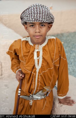 Boy with traditional dress from Sur