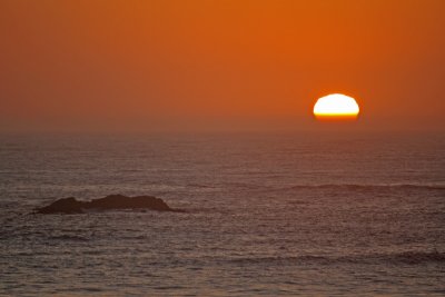 Sunset and distant rock