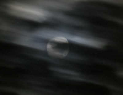 Clouds cross the Moon
