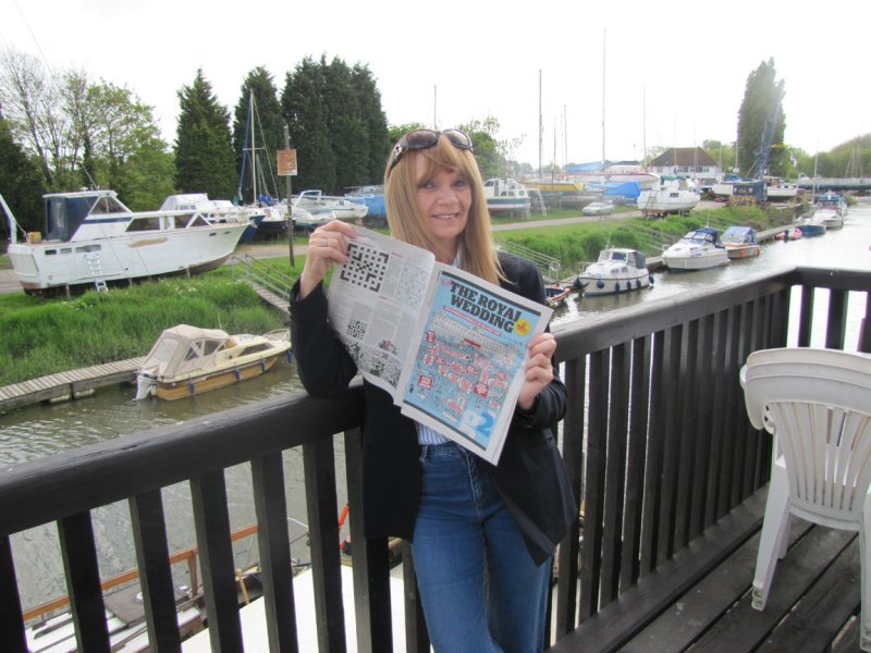 Reading about The Royal Wedding on our balcony in Sandwich
