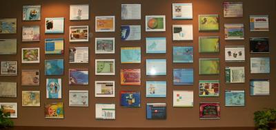 Wall at Jason's office showing clients