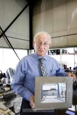Henk Rozema (70) displays his invention: 'Digizerk', the digital tombstone.
