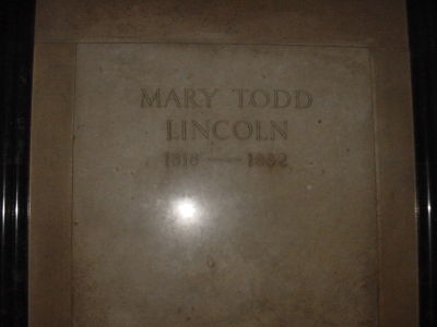 Mary Todd Lincoln is buried across from Lincoln and next to their children.