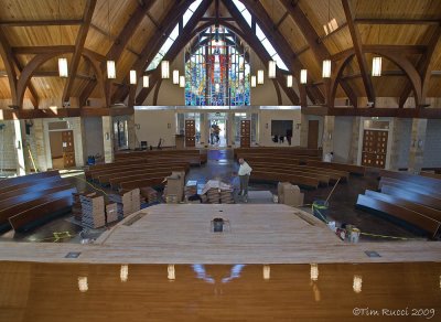 76575 - Platform being stained; pews being assembled