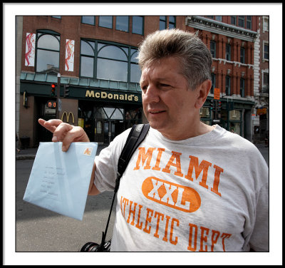A Welshman with a Miami T-shirt in front  of McD's in a Canadian city.