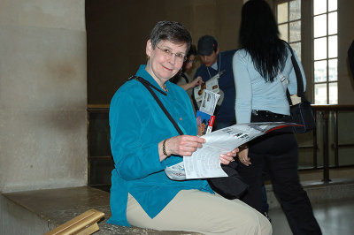 Glynda studying the map of the Louvre collection