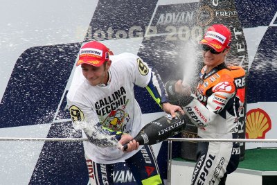 SEPANG, MALAYSIA - OCTOBER 25: Valentino Rossi (left) celebrates his win at the Shell Advanced Malaysian Motorcycle Grand Prix 2