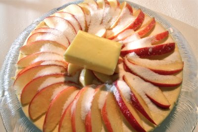 Fan apple wedges, sprinkle w/sugar & top w/butter