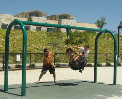 Tyler swinging the kids around