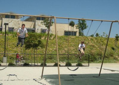 Andre & Evan swinging around - Laura on the bike in the background