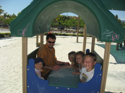 Tyler playing with the children