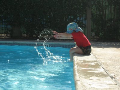 Dylan enjoying making water trails