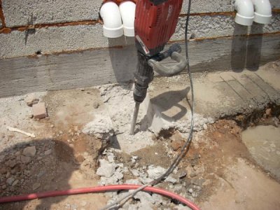 Removing the footing for roof drains