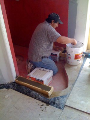 Carlos builds a footing for the glass block