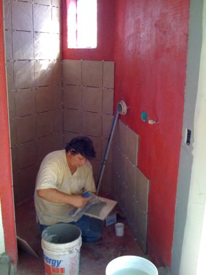 Setting the tiles in the master bath