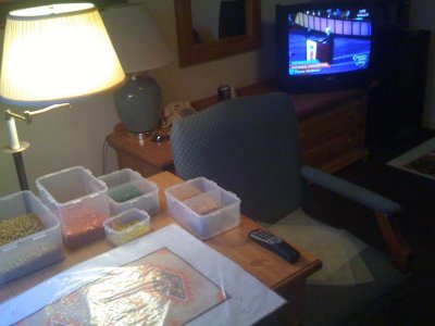 Jim works on the floor mosaic in his hotel room