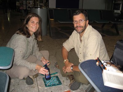In Heathrow, Jim and Cyn with the usual (vodka, chocolate, and scrabble)