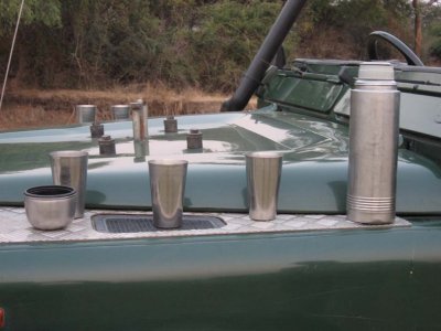 Amarula sundowner preparation on the jeep hood