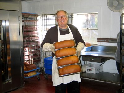 Father Augustine Foley With Freshly Baked Loaves