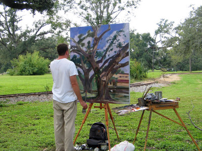 An Art Student  Studies the Live Oaks