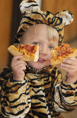 Simon pigs out on pizza