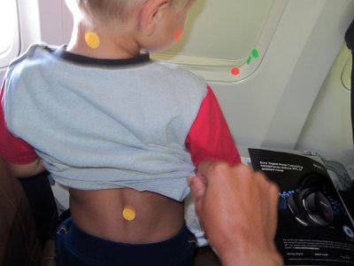 On the airplane: body art