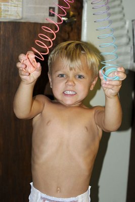 Our favorite shot - this kid is serious about his slinky!