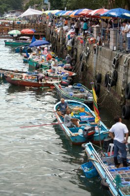 Fishmongers line the dock