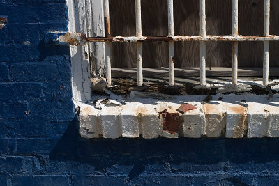 rusty window in blue