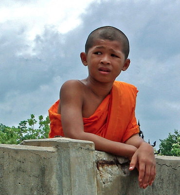 Novice monk at riverside
