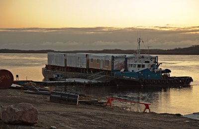 Barge and tug at sunrise