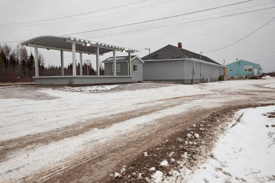 Moosonee station: covered structure, new shed, newly sided station and freight/express building
