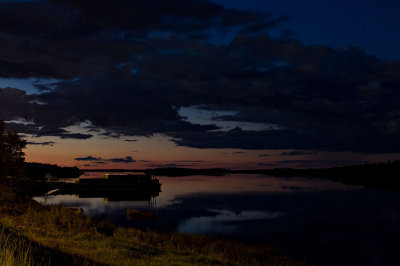 Night view down river past barges