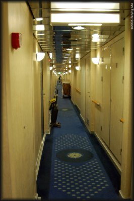 Long hall way on both sides of the ship