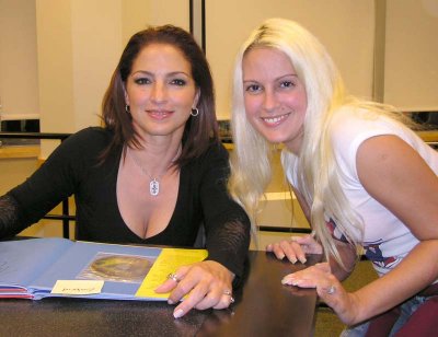 Gloria poses with a fan