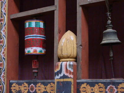 Prayer wheel and bell at temple entrance, Trongsa Dzong, Bhutan