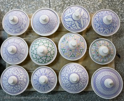 131Painted Pots ready for firing.jpg