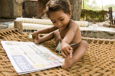 Rose Mary reads  her newspaper