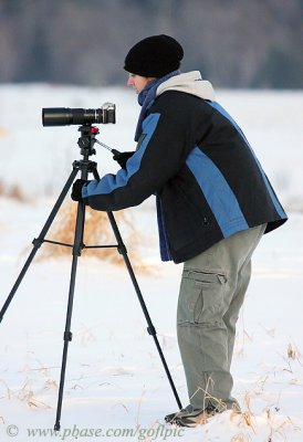 A photographer sets up despite freezing temperatures