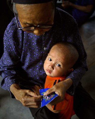 Kam child and his grandmother.