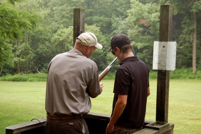 Clay Shooting Guide Mike Woodruff gives Tyler some pointer's on how to load his Gun
